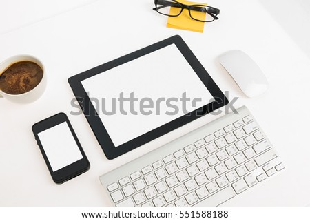 Digital tablet touch pad computer with keyboard, mouse and coffee in office table business