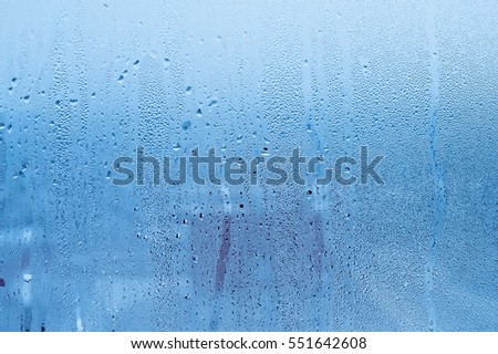 Window glass with condensation, strong, high humidity in the room
