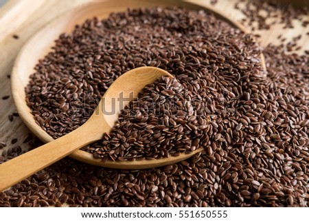 Brown flaxseed, organic food for healthy eating. Royalty-Free Stock Photo #551650555