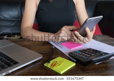 Woman's hands holding smartphone for online shopping
