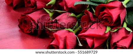 Beautiful Valentine red roses red wood table, sized to fit a popular social media cover image placeholder.