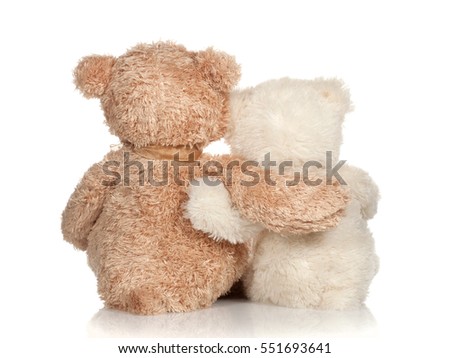 white and brown teddy bear that hugs Royalty-Free Stock Photo #551693641