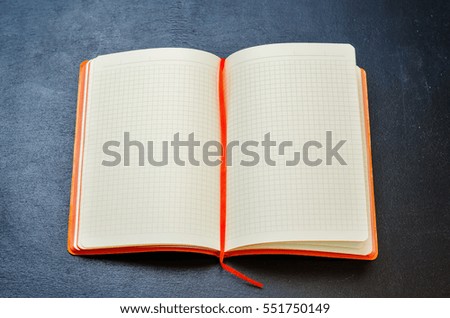 Open office Notepad on a black chalk background