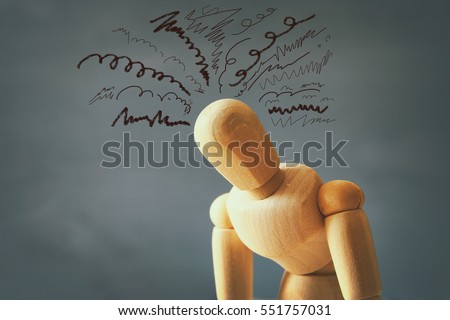 image of wooden dummy with worried stressed thoughts. depression, obsessive compulsive, adhd, anxiety disorders concept Royalty-Free Stock Photo #551757031