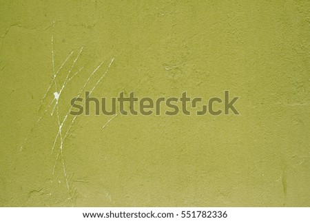 Green wall with scratches isolated as a background or texture