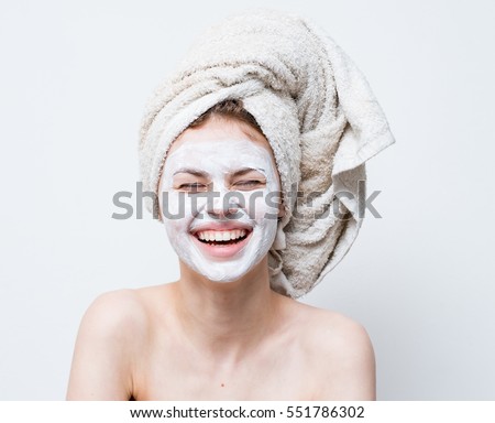 smile, cream on her face, woman Royalty-Free Stock Photo #551786302