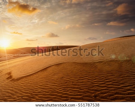 White sand dunes on sunrise, Mui Ne, Vietnam Royalty-Free Stock Photo #551787538