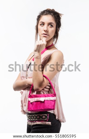 Girl wearing pink blouse and blacks shorts, studio portrait