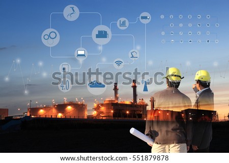 two engineer on site , Industry 4.0 concept image.Oil refinery at twilight with cyber and physical system icons diagram on industrial factory and infrastructure background.