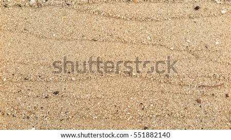 Texture lines of sand on the beach Royalty-Free Stock Photo #551882140