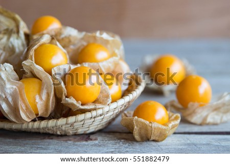 Cape gooseberry fruit , organic golden berry in basket Royalty-Free Stock Photo #551882479