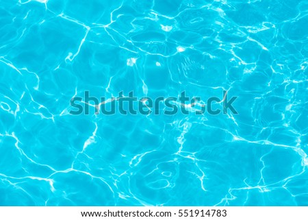 surface of blue swimming pool,background of water in swimming pool. Royalty-Free Stock Photo #551914783