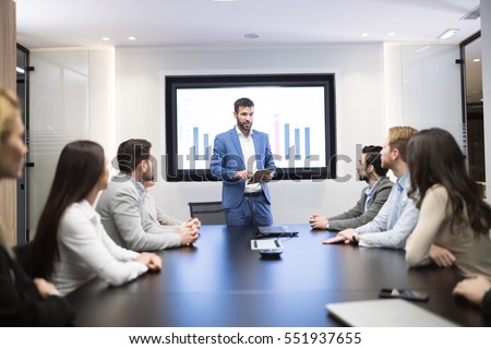 Business meeting and presentation  in modern conference room for colleagues