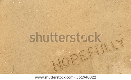 Handwriting words "HOPE FULLY on sand of beach