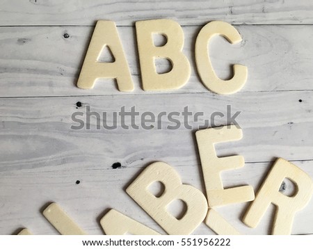 abc wooden letters on white wooden background. ABC