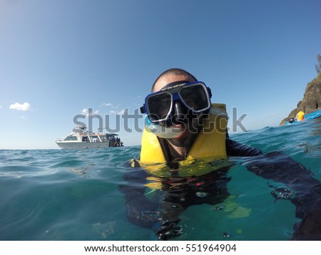 Scuba Diver Underwater taking a selfie in Whitsundays, Australia