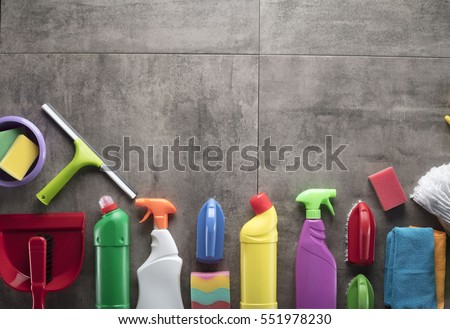 Cleaning products. Home cleaning concept. Top view. Place for typography and logo. Royalty-Free Stock Photo #551978230