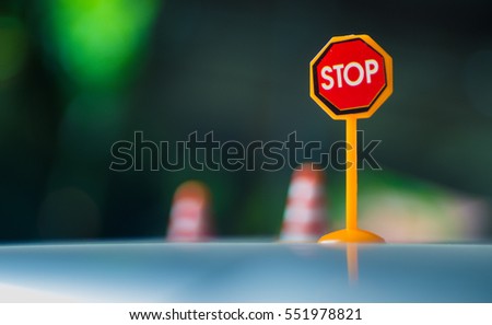 toy road sign with stop sign