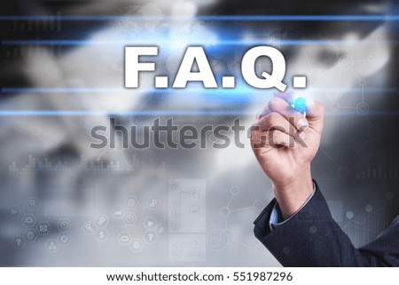 Businessman is drawing on virtual screen. f.a.q. concept.