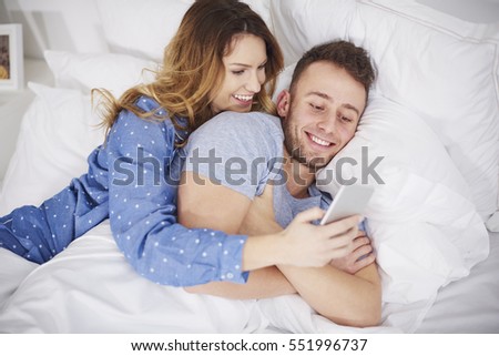 Picture of young couple with smart phone

