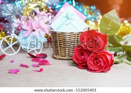 red rose bouquet and gifts beautifully arranged on a table for Valentine's Day
