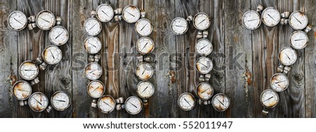 2017 new year background, 2017 sign by tools or equipment on wooden background, new year idea of spare part or tools in workshop or the garage, tools and pressure gauge on wooden background.