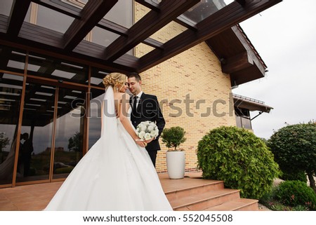 Wedding day, happy couple hugging outdoor