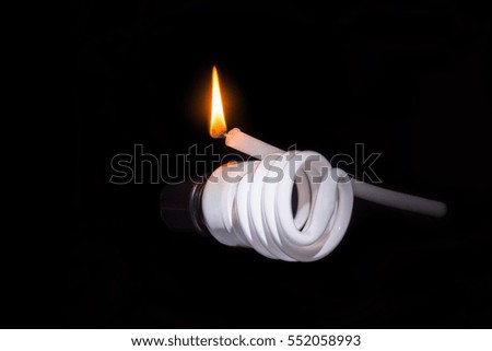 candle with frame light and flashlight on floor in dark background
