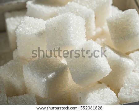 Close up shot of white refinery sugar. Royalty-Free Stock Photo #552061828