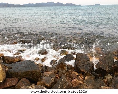 Sea waves against the rock beach.