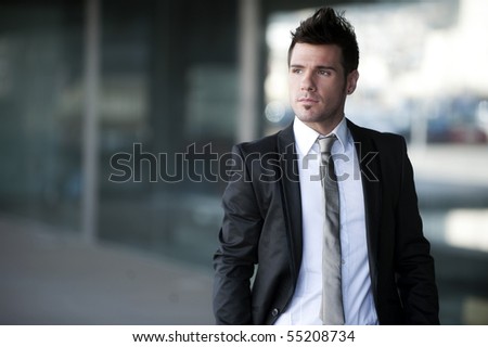 Young businessman in urban background