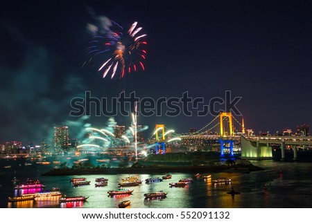 Fireworks and Tokyo skyline with Tokyo tower and rainbow bridge  in Japan