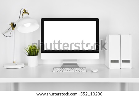 Blank screen computer, lamp and table folder over white background