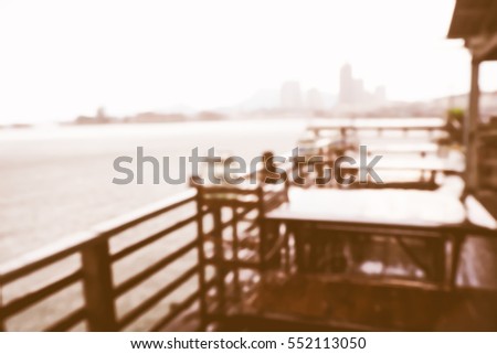 Picture blurred  for background abstract and can be illustration to article of table in restaurant near sea