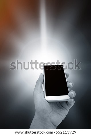 Man's hand shows white smartphone in vertical position on abstract technology background in blue and orange color tone- mockup template