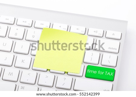 Time for tax written on computer keyboard.