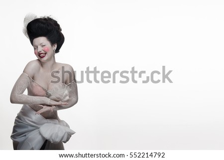 emotional actress brunette woman in the role of a vampire on a white background