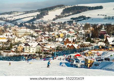 Skiing in the Tylicz - ski station panorama Royalty-Free Stock Photo #552231619