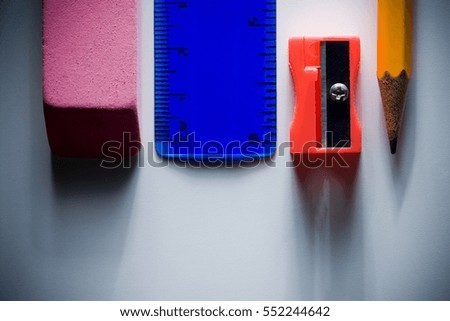 Eraser, ruler, pencil sharpener and pencil