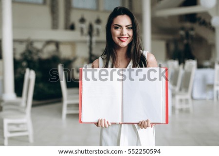Restaurant manager. Business woman with folder restaurant menu.