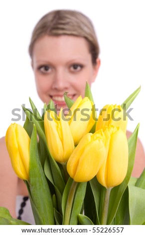 Woman with flowers.  Picture of happy blond with and yellow tulips.  Spring beauty. Pretty young female holding bouquet of tulips isolated on white background .