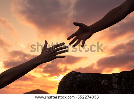 Lending a helping hand. People helping each other concept.  Royalty-Free Stock Photo #552274333