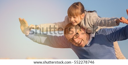Father with daughter having fun at the day time.