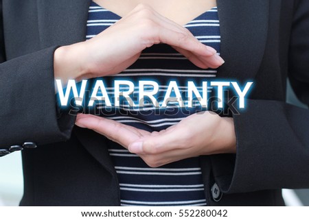 Close up of the hand of business-woman show the word popup "warranty" or protect these word