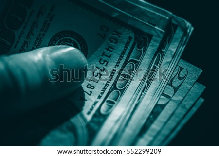 US dollars in arm. 