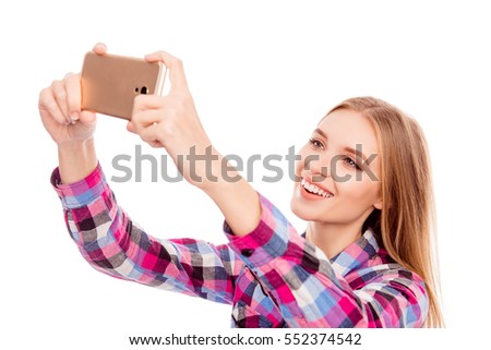 Happy smiling woman taking selfie photo on smartphone