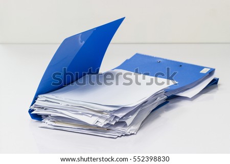 file folder with documents and documents retention of contracts on table in meeting room 