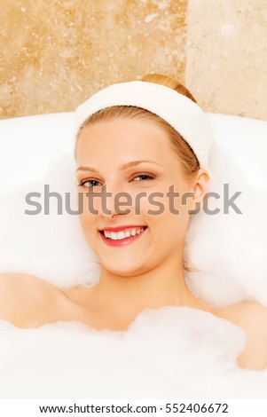 A young woman in the bath