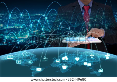 businessman in black suite using tablet control the world , internet of things concept