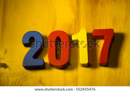 2017 year text wood on modern wooden on wooden background